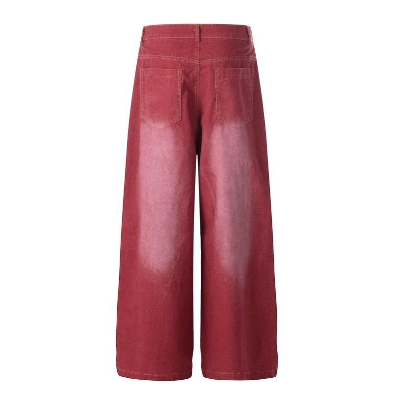 Back view of vintage red wide-leg jeans with faded denim and plain patch pockets