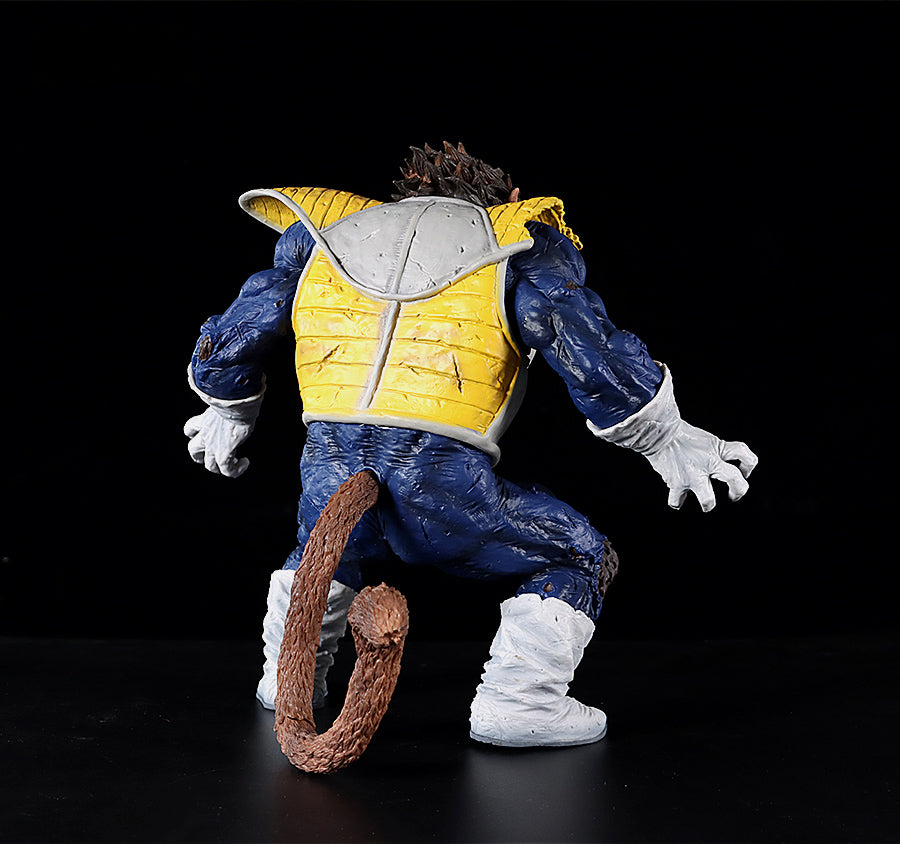 The Seakoff Great Ape Vegeta Collectible Figure, a 36cm premium action figure from Dragon Ball Z, showcases a humanoid character with a tail in a blue suit, yellow vest, white gloves, and boots. Crouched against a dark backdrop, it evokes the essence of Great Ape Vegeta.