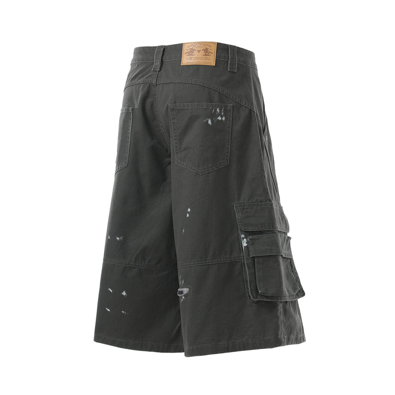 Black cargo shorts back view with leather waistband patch and side cargo flap pockets