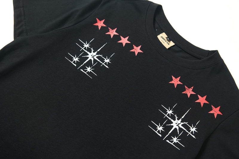 Black Seakoff graphic tee with red star emblems and white starburst prints on the chest and shoulder area