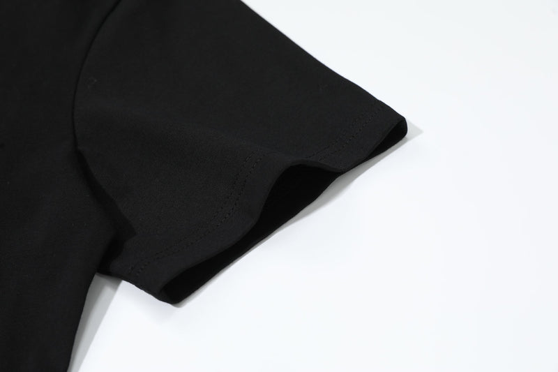 Black oversized T-shirt sleeve with stitched hem on a clean white background