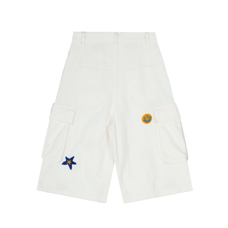 White cargo shorts back view with plain pockets and one smiley patch