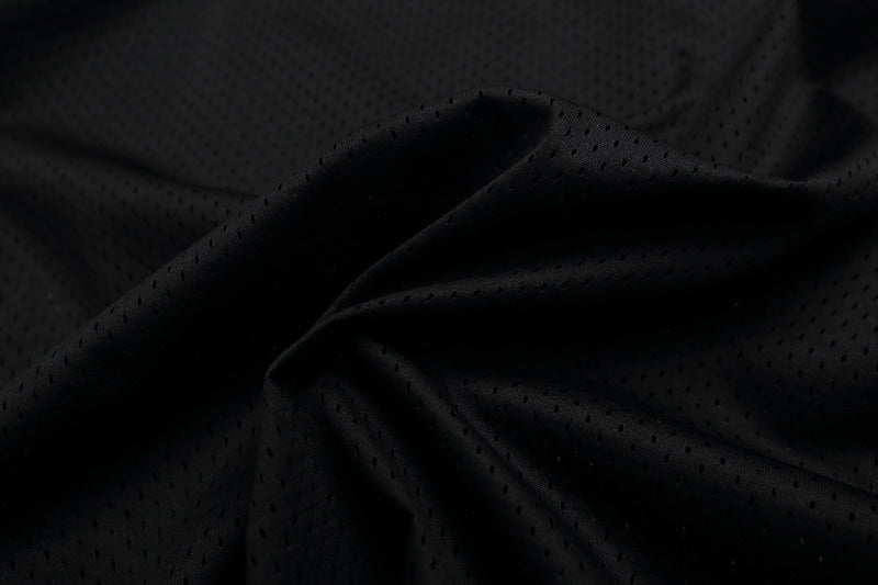 Black breathable mesh fabric close-up for Dalwren 23 varsity football jersey streetwear t-shirt