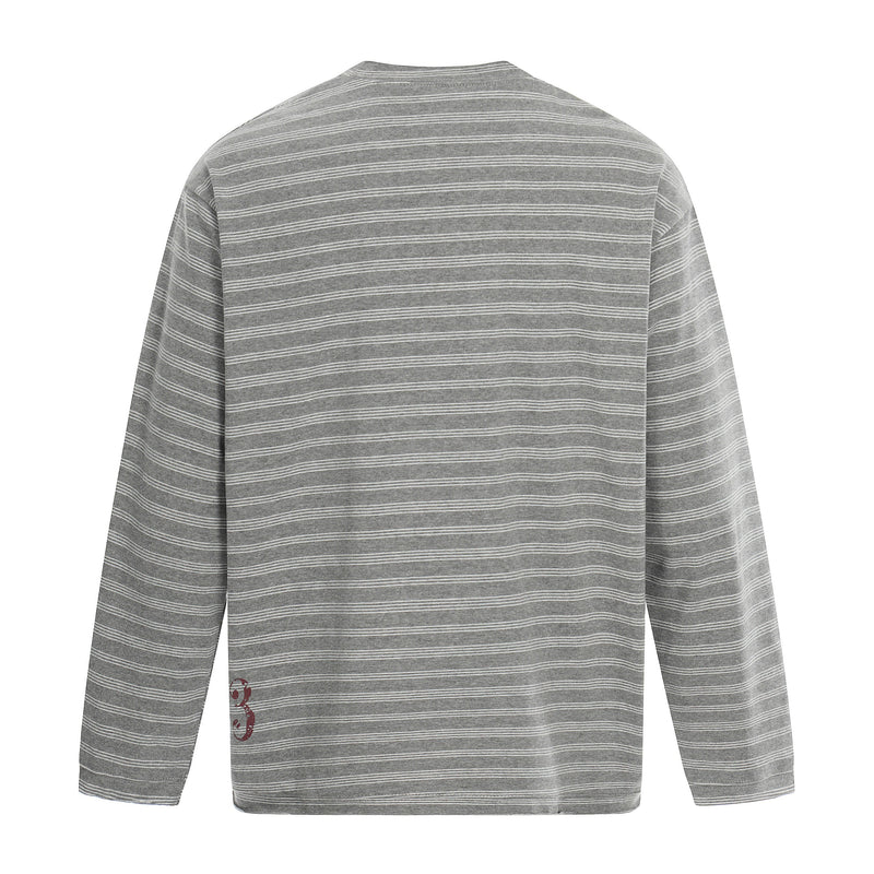 Gray striped long sleeve tee back view with partial red graphic near lower left hem