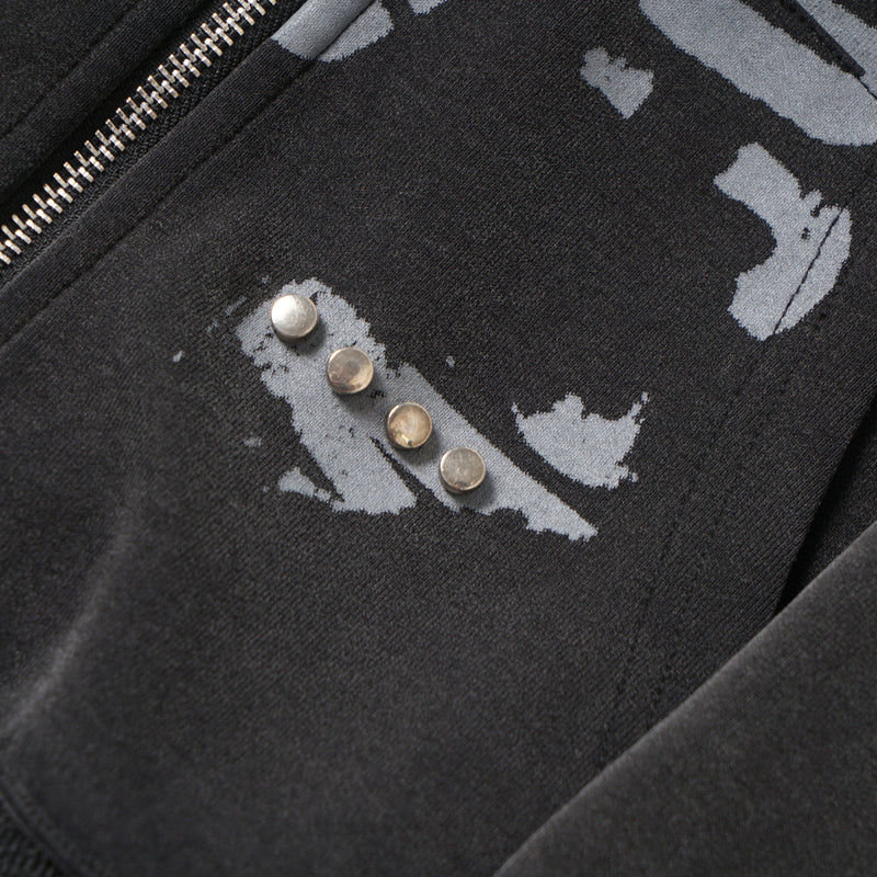 Close-up of chest print and zipper edge on black cropped zip hoodie