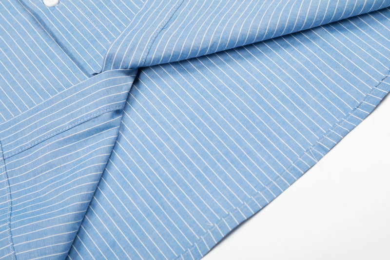 Close-up of blue striped shirt sleeve and side seam with folded fabric