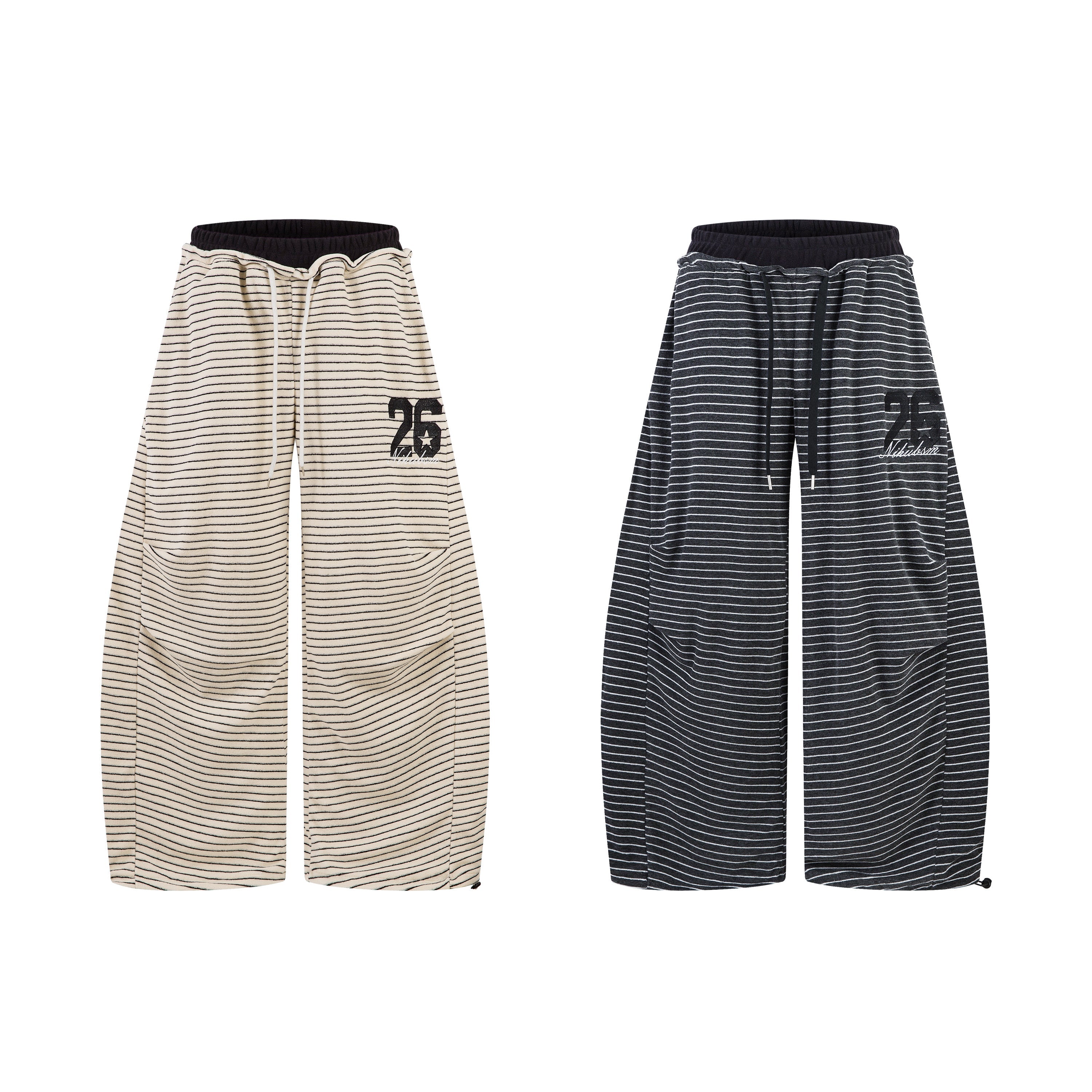 Cream and charcoal striped barrel-leg lounge pants with black elastic waistband and embroidered 26 logo, shown flat lay front