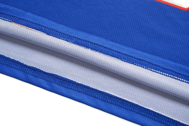 Close-up of blue mesh varsity crop jersey with white paneling and visible athletic stitching