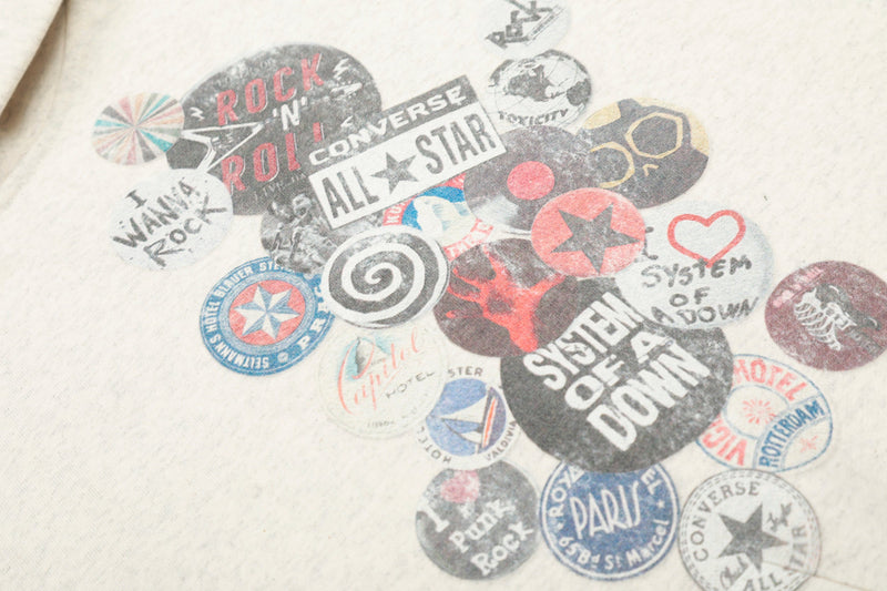Close-up of retro badge collage print with circular logos and rock-themed text