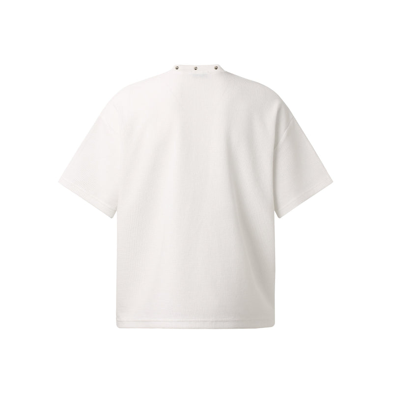 White oversized waffle-knit streetwear tee with relaxed short sleeves and snap-button mock neck detail
