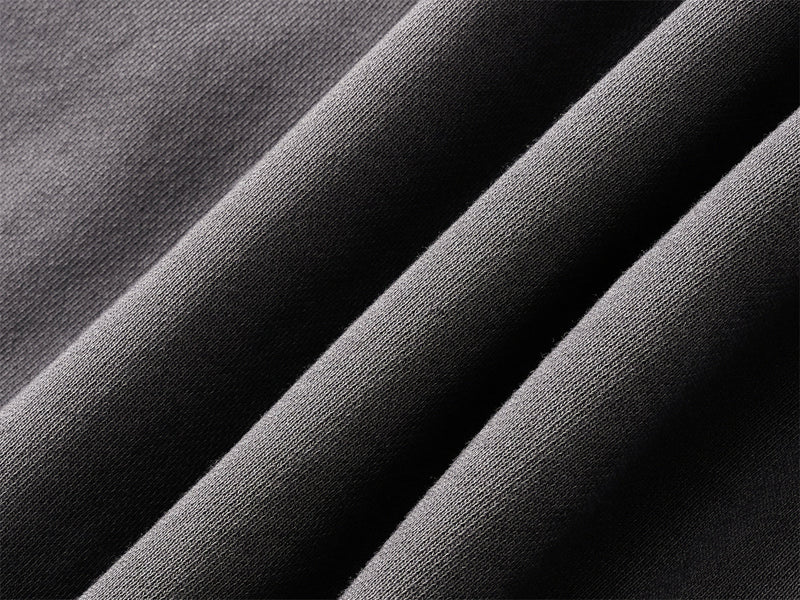 Close-up of black washed cotton fabric with soft folded texture