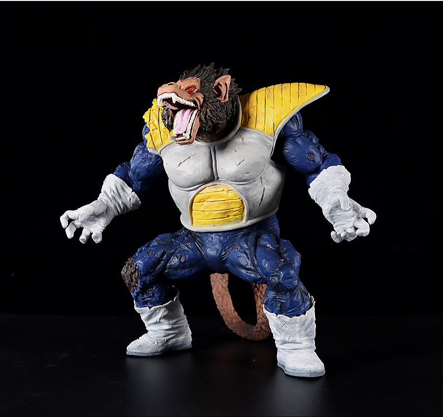 The Seakoff Great Ape Vegeta Collectible Figure from Dragon Ball Z, a 36cm premium action figure, is captured against a black backdrop. It boasts blue and yellow armor with white gloves and boots, an open mouth showcasing sharp teeth, and a long brown tail extending behind.