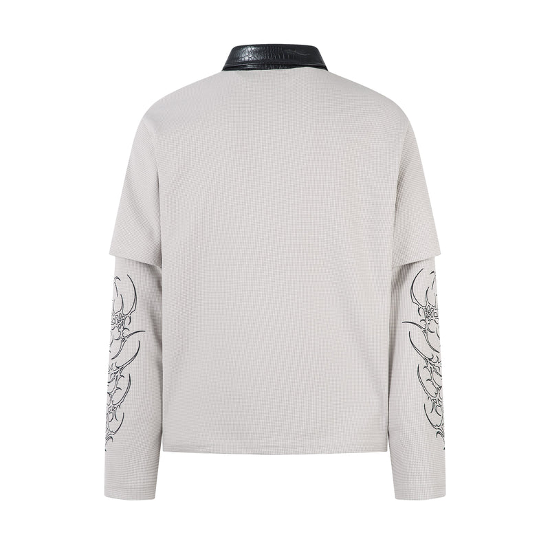 Back view of white layered long sleeve polo shirt with printed sleeves and plain back