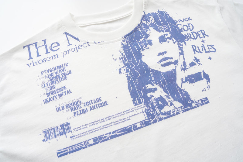 Off-white long sleeve graphic tee front with blue portrait and text print