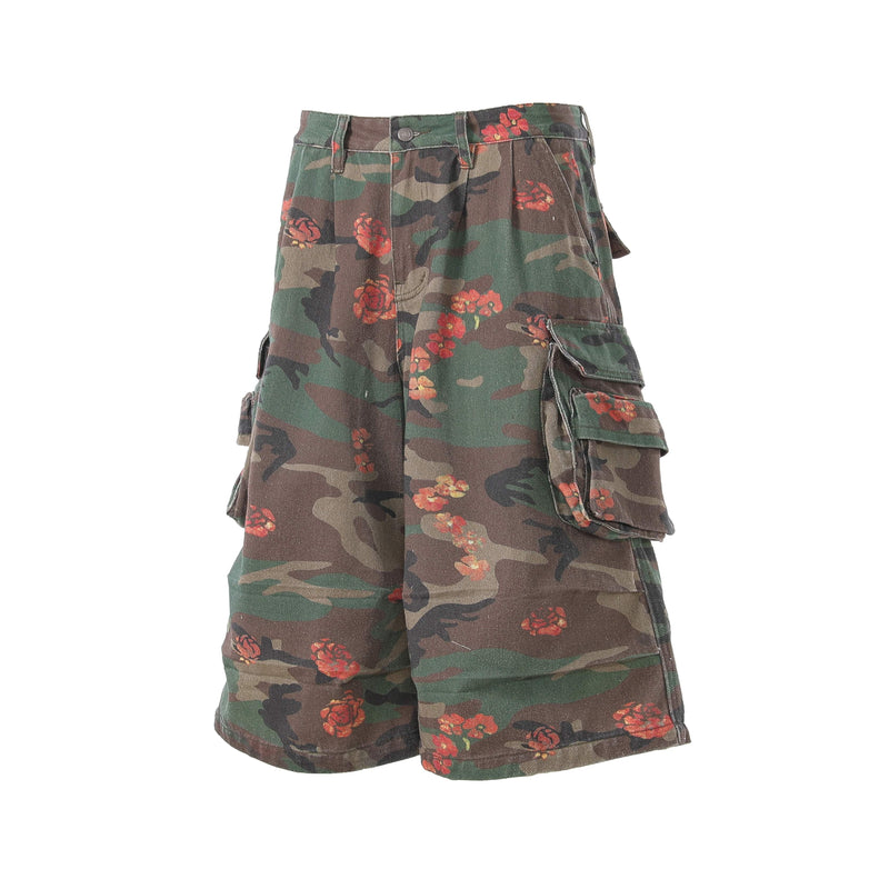 Side view of floral camo cargo shorts showing layered cargo pockets and wide leg