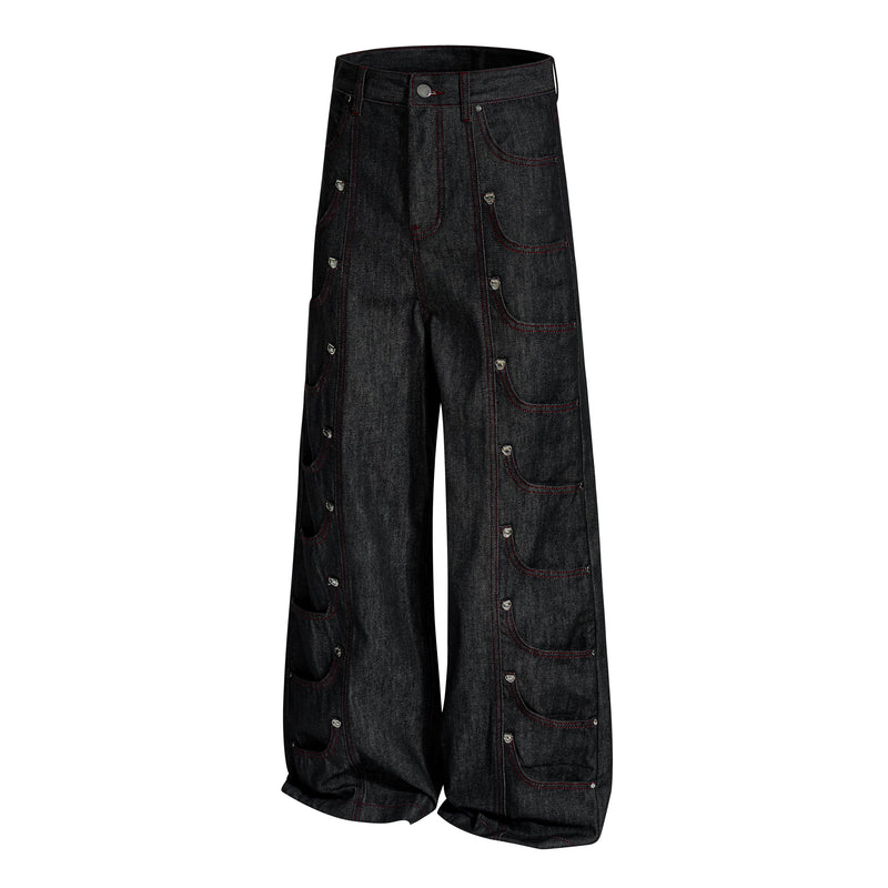 Angled front view of black wide-leg denim pants with red stitching and side cargo-style pockets