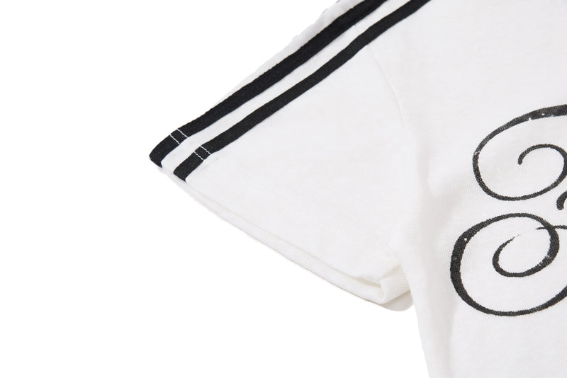 White men’s polo shirt with black striped trim and vintage music script graphic print on the sleeve and chest