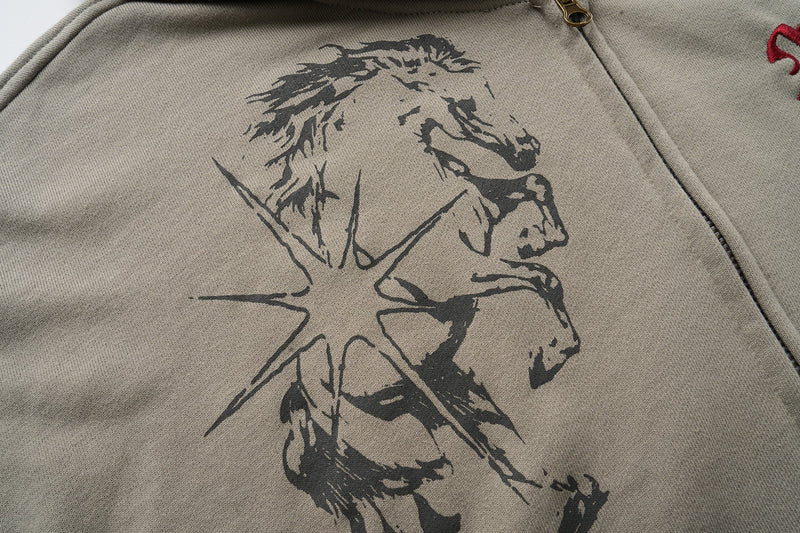 Close-up of black horse graphic printed on the front of the taupe hoodie