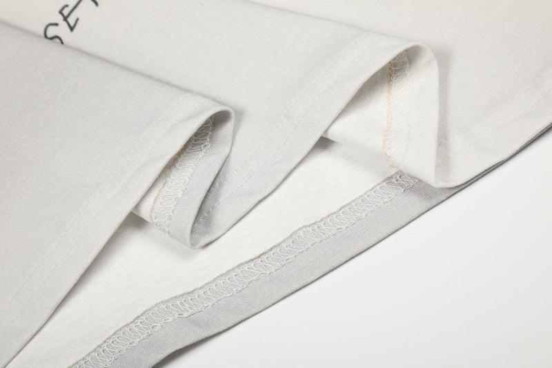Close-up of sleeve hem with visible seam stitching and inner fabric layer