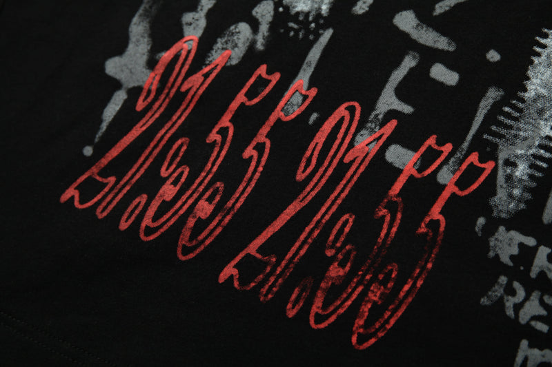 Black crop tee with red graffiti-style script and gray patchwork print for an edgy underground streetwear look
