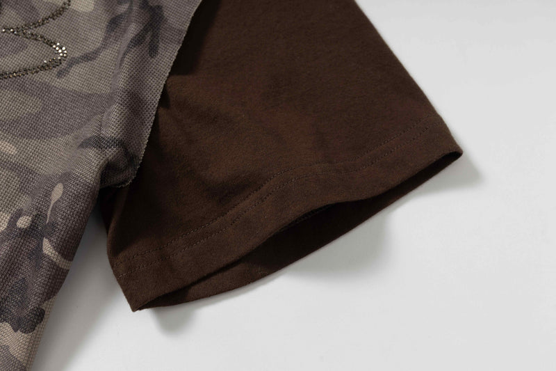 Close-up of brown camo hooded short-sleeve tee with oversized hem and textured streetwear fabric
