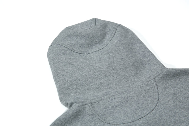 Close-up of gray hoodie hood back with curved seam panel