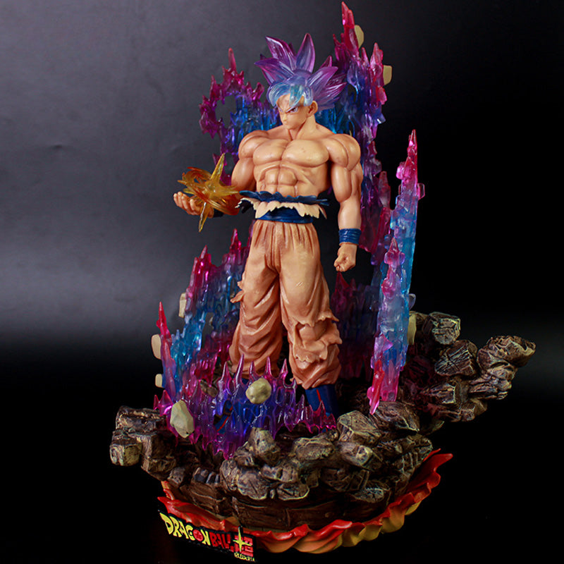 The Seakoff Goku Ultra Instinct Collectible Figure features a muscular character with purple spiky hair standing on rocky terrain, holding glowing energy surrounded by pink and blue energy spikes. The 35cm statue&