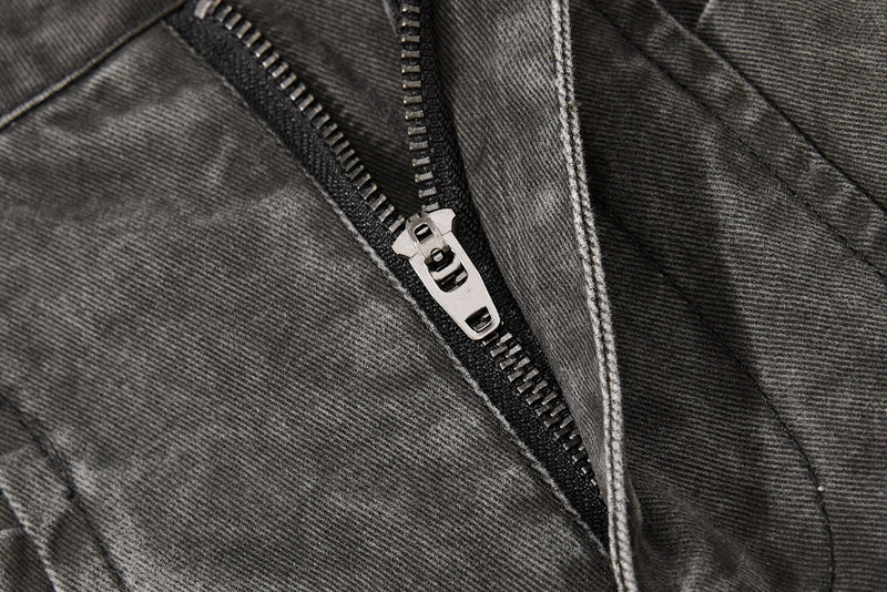 Dark charcoal denim zipper close-up with silver zipper pull