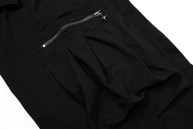 Close-up of black cargo pants rear pocket with zipper and star pull