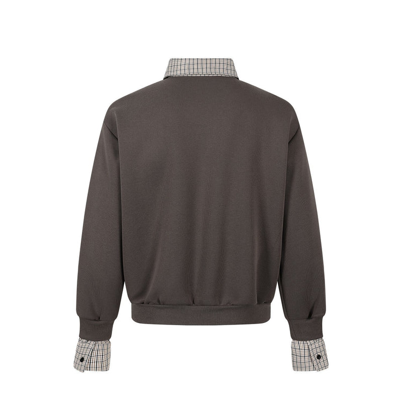 Back view of dark brown relaxed-fit pullover with plaid collar and plaid cuff trim