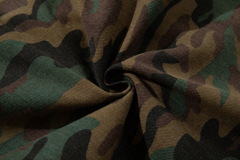 Close-up of gathered woodland camo fabric texture
