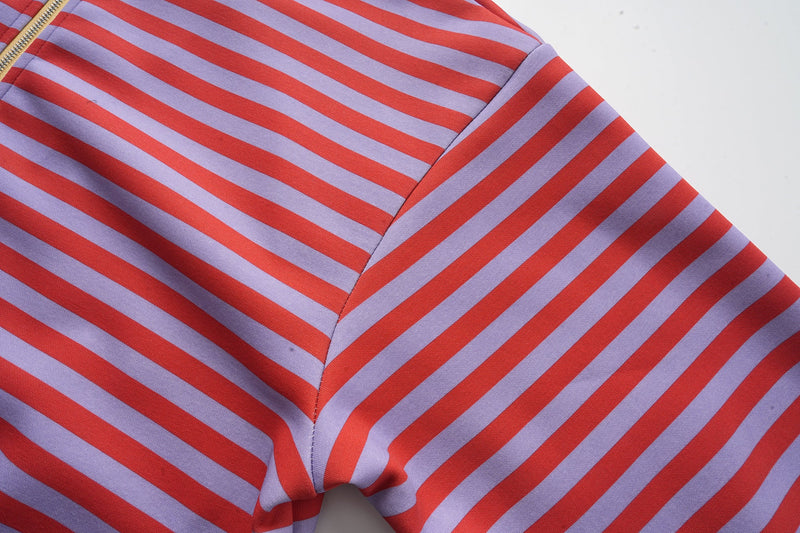 Close-up of striped hoodie sleeve and shoulder seam
