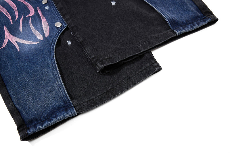 Close-up of hem area on black and blue graphic wide-leg denim
