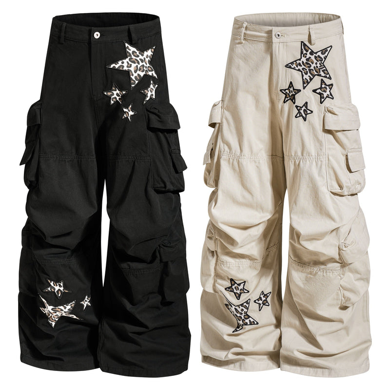Black and beige cargo pants with leopard star patches, shown front view side by side