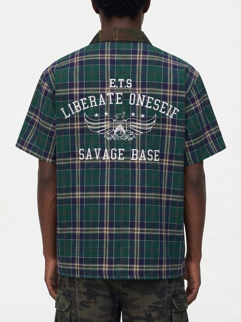 Green and navy plaid short-sleeve shirt with camo collar and bold Savage Base graphic on the back