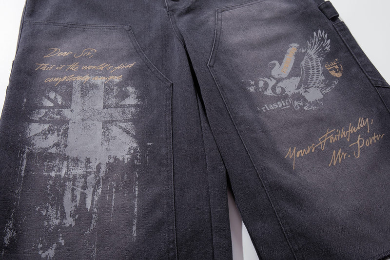 Close-up of front legs with vintage graphic print on dark denim shorts