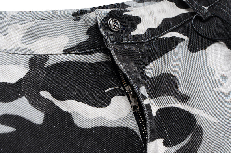 Close-up of camo shorts waistband with zipper fly and snap button detail