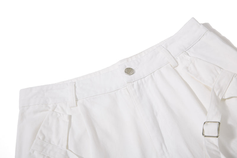 White shorts waistband and front pocket detail with snap button