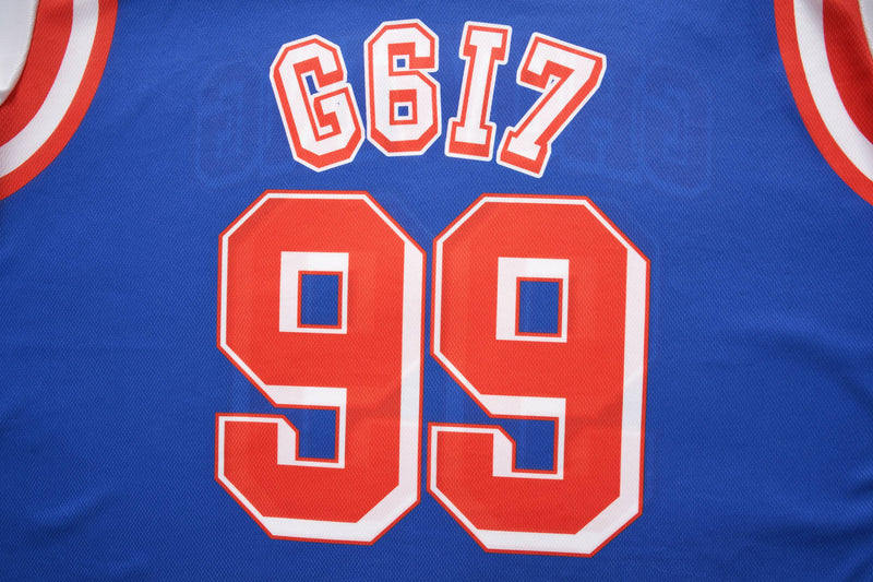 Blue varsity mesh crop jersey with red and white 99 graphic and 617 lettering on the chest