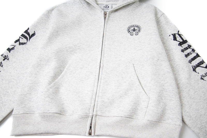 Front view of white zip-up hoodie with hood, pockets, and black chest crest graphic