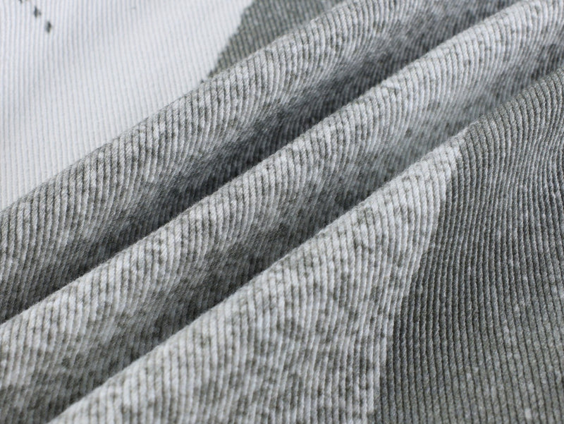 Close-up of ribbed gray fabric texture on the pants