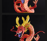 Close-up of the Red Shenron Collectible Figure by Seakoff, a high-detail 30cm dragon statue from Dragon Ball Z, featuring intricate red scales, sharp claws, an open mouth with a blue tongue and fangs, and elaborate horns against a black background.