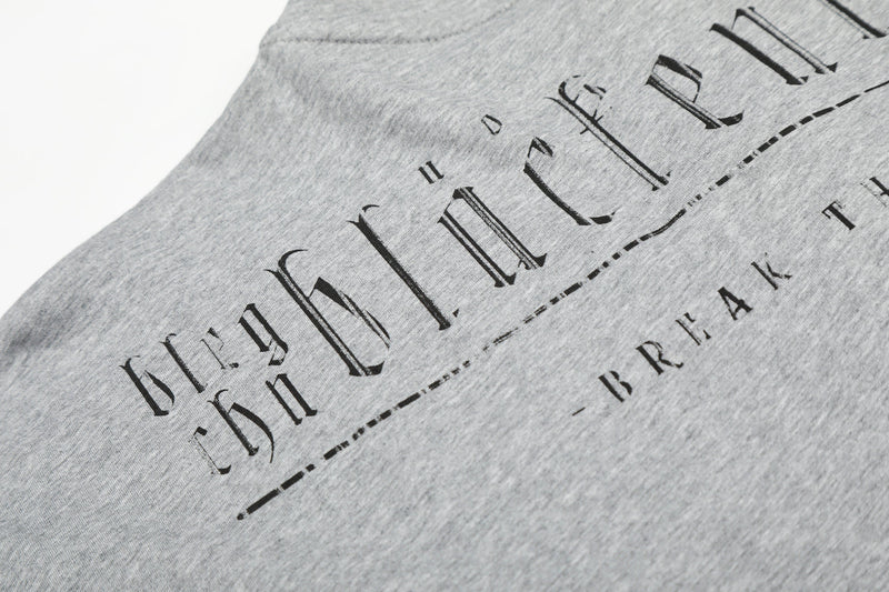 Gray tee back close-up showing arched graphic text and shoulder seam