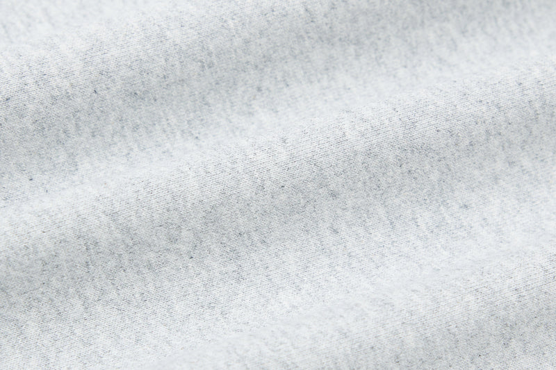 Close-up of light gray hoodie soft knit fabric texture