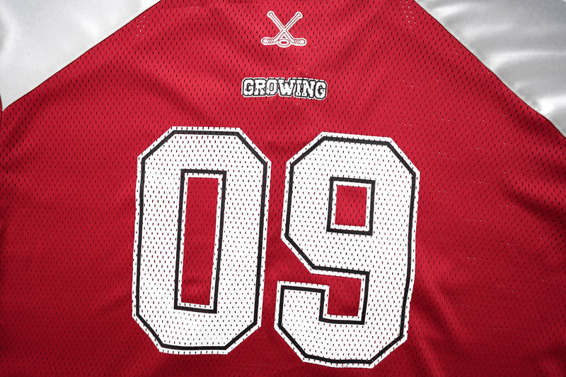 Red varsity mesh hockey jersey with large white number 09 and GROWING graphic on the chest