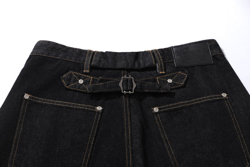 Close-up of back waistband and belt detail on black cargo denim pants
