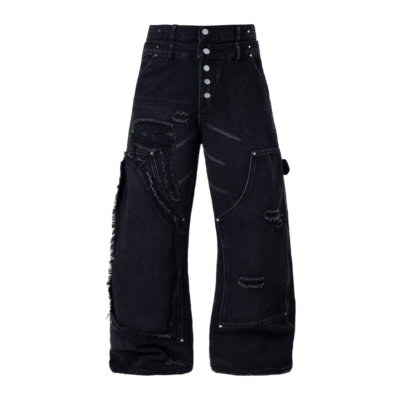 Front view of black distressed denim pants with button fly and panel seams