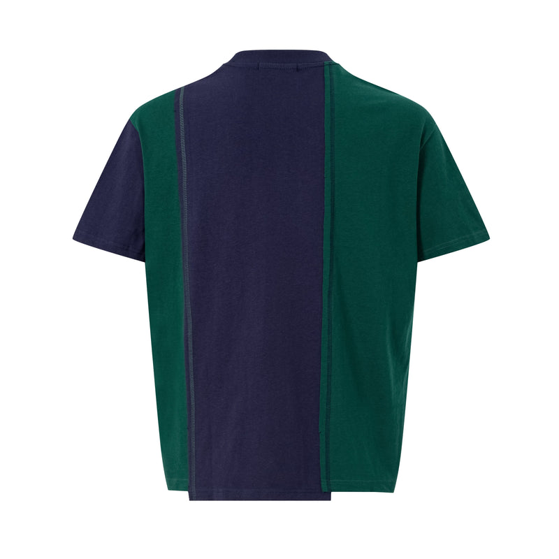 Back view of an oversized vintage sportswear tee with navy and green colorblock panels and contrast seam stitching