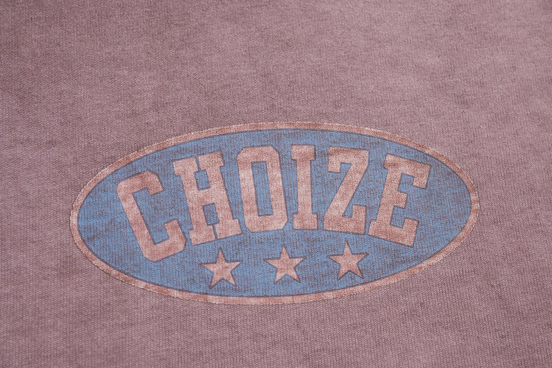 Vintage-wash mauve tee with faded blue CHOIZE oval racing graphic and three stars on the chest