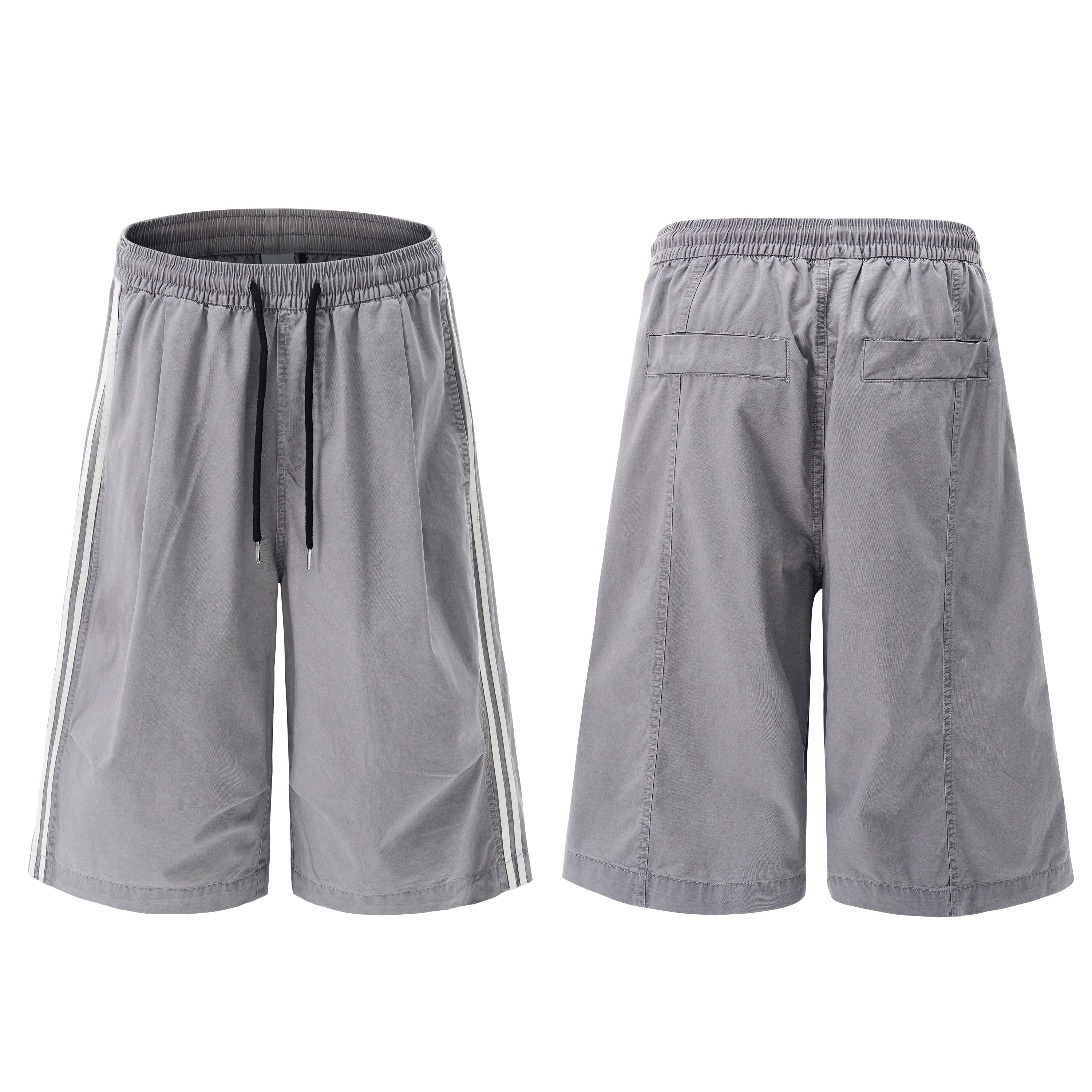 Men's grey washed wide-leg shorts with white contrast side stripes and black drawstring elastic waistband, front and back vie